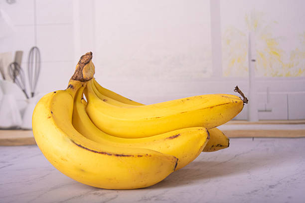 istock Bananas, bunch of ripe bananas in a bright environment, selective focus. 2217843556