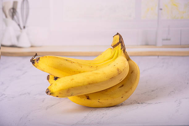 istock Bananas, bunch of ripe bananas in a bright environment, selective focus. 2217843563