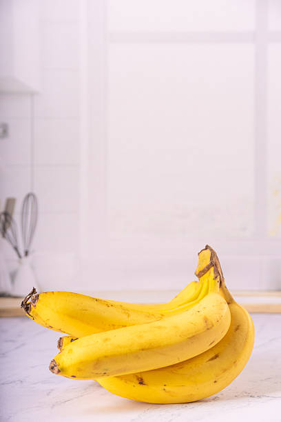 istock Bananas, bunch of ripe bananas in a bright environment, selective focus. 2217843564