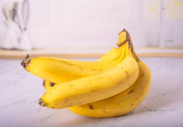 istock Bananas, bunch of ripe bananas in a bright environment, selective focus. 2217843565