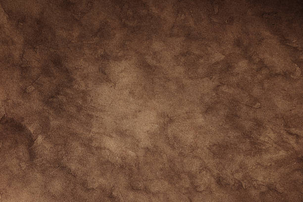 istock Vintage-style aged paper background with organic grain and distressed surface 2217846783