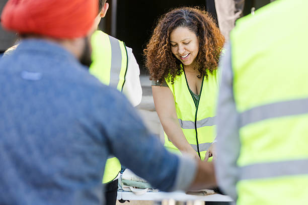 istock Teamwork and Collaboration: Diverse Group of Construction Workers Meeting 2217851932