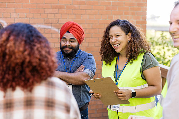istock Diverse group of volunteers talking during community outreach 2217852028