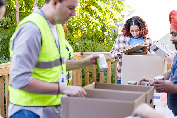 istock Volunteers sorting donations at community outreach event 2217852269