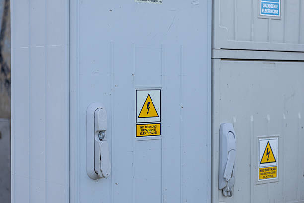 istock Outdoor electrical hazard warning sign with lightning icon and text Do not touch Electrical device on grey cabinet promotes safety 2217855949