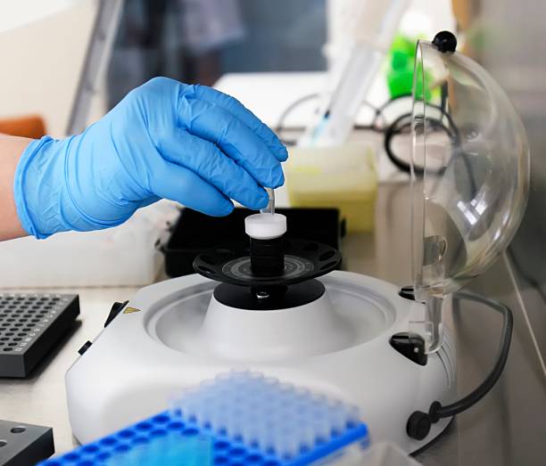 istock Laboratory technician conducting analysis with centrifuge in modern research facility during daytime 2217857766