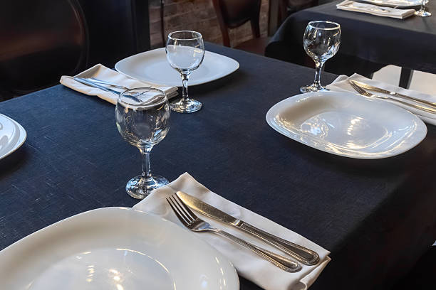 istock Elegant table setting for a gourmet dinner celebration with fine glassware and stylish cutlery in a modern restaurant ambiance 2217859306