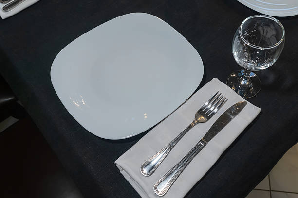 istock Elegant table setting for a gourmet dinner celebration with fine glassware and stylish cutlery in a modern restaurant ambiance 2217859309