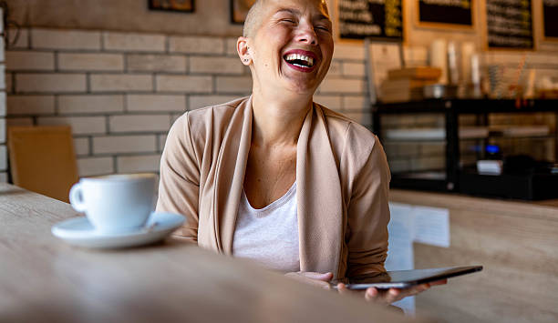 istock Woman working on laptop in a coffee shop 2217860746