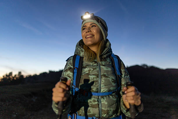 istock Woman hiking at night 2217861494