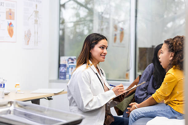 istock Pediatrician Talking with a Young Patient in Her Office 2217861612