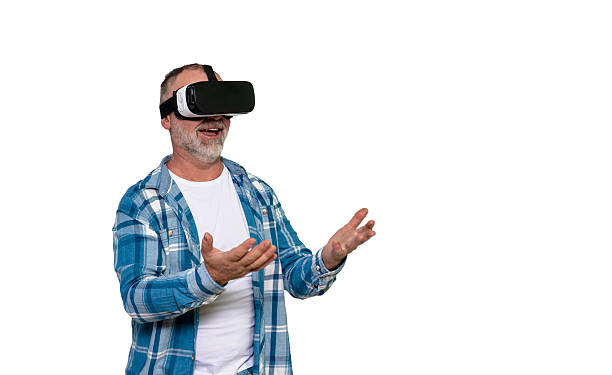 istock Senior man experiencing virtual reality in home environment while expressing excitement and engagement 2217862469