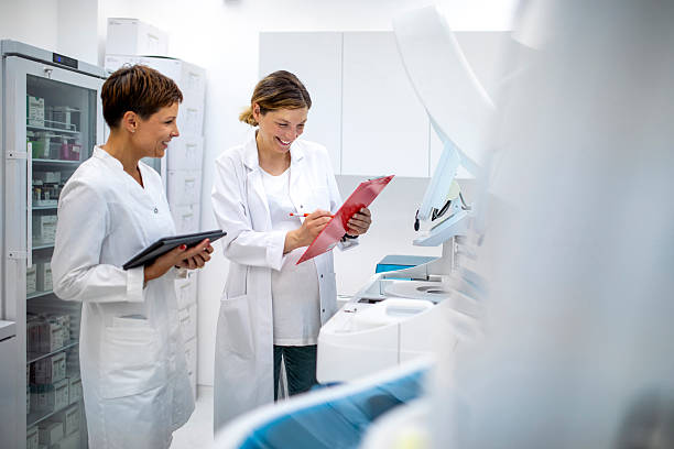 istock Mid Adult Female Scientists Collaborating in Bright Laboratory Environment 2217864086