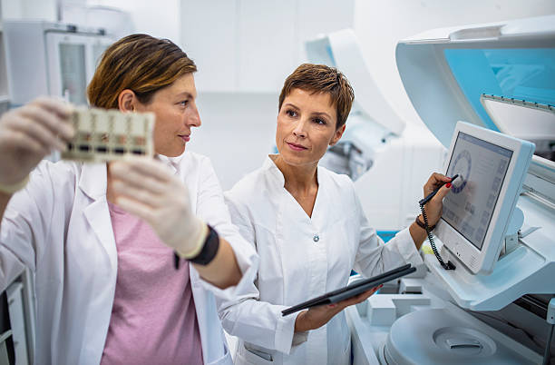 istock Mid Adult Female Lab Professionals Analyzing Samples in Modern Laboratory Setting 2217864107