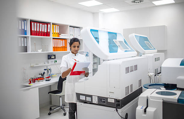 istock Young Medical Researcher In White Lab Coat Working With Advanced Diagnostic Equipment In Clinical Laboratory 2217864115