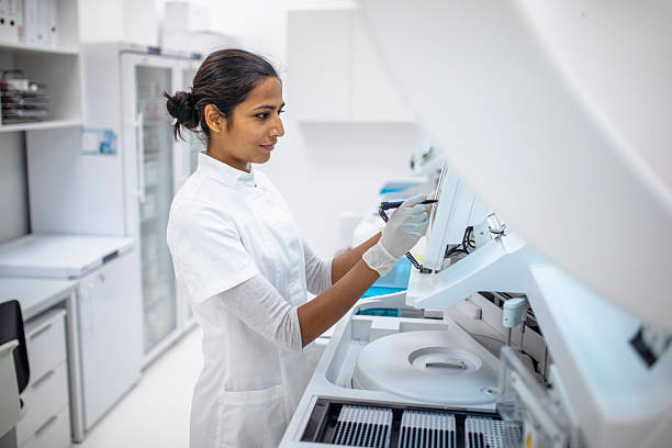 istock Young Indian Female Researcher in White Lab Coat Working in a Modern Laboratory 2217864122