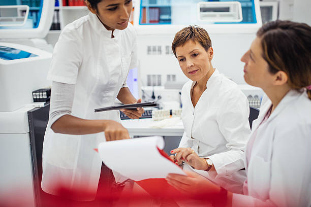 istock Focused Female Researchers Collaborating in a Modern Laboratory Wearing White Lab Coats 2217864457