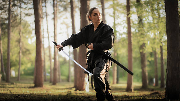 istock Ninjutsu training in nature with a sword 2217867531
