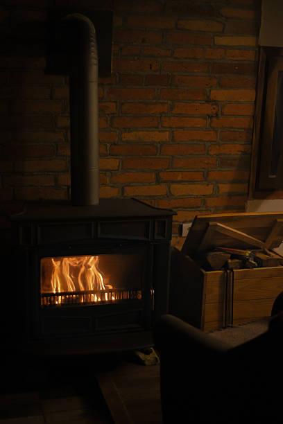 istock Cozy room with fireplace and armchair 2217869129