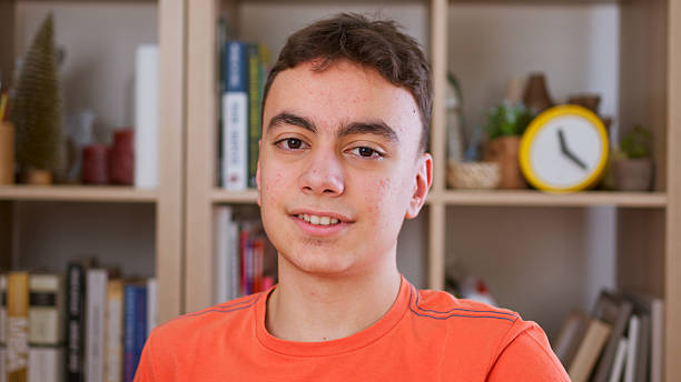istock Teenage boy  making video call, looking at camera and talking 2217872718