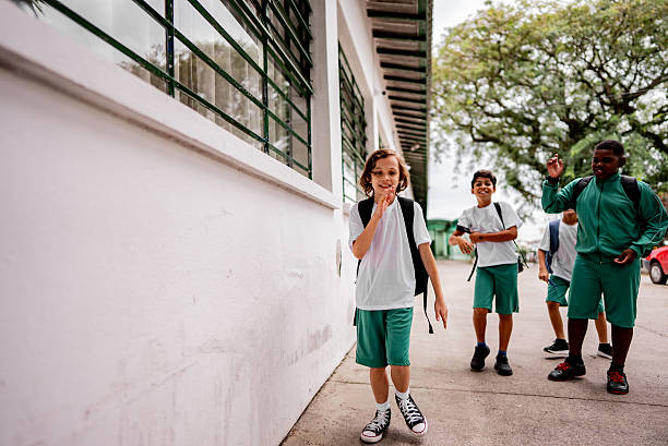 istock Child students talking and walking at school 2217873437