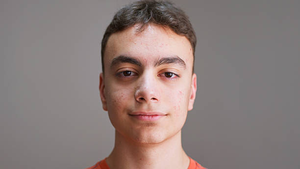 istock Teenage boy  making video call, looking at camera 2217874368