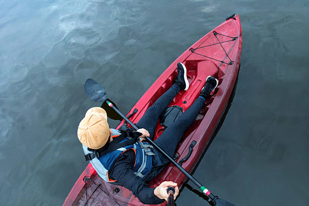 istock Kayaking at sunrise on a calm lake for a peaceful outdoor experience 2217880409