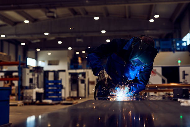 istock Skilled Worker Welding Metal in a Modern Industrial Workshop Setting 2217880833