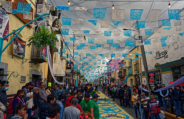Huamantla, Tlaxcala, Mexico - August 14, 2022: People are celebrating the holiday of Nadie Duerme with making multi colored sawdust carpets