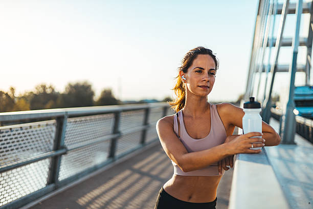 istock Woman Taking a Rest During Workout on a Bridge 2217888243