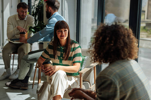 istock Young businesswomen chatting during coffee break in modern office 2217889180