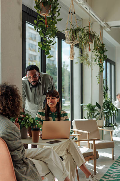 istock Coworkers having a meeting in a modern green office 2217889217