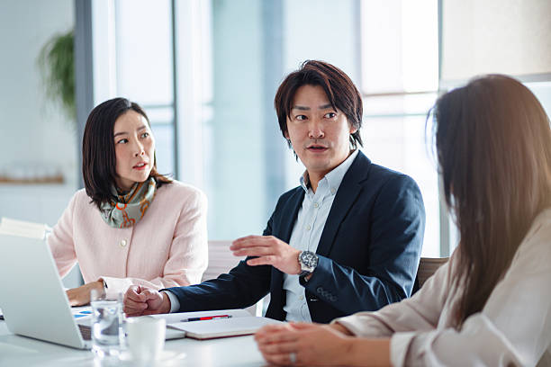istock Asian Businesspeople in a Meeting Discussion 2217890124