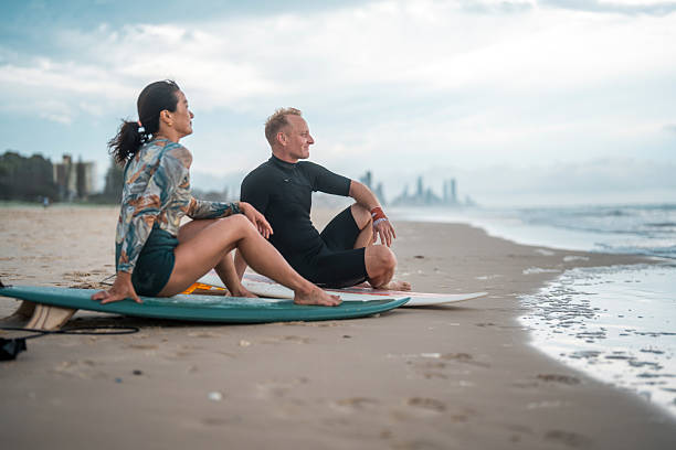 istock Relaxed Surfing Couple Enjoying Gold Coast Beach 2217890185