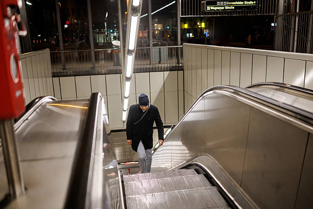 istock Male commuter on subway escalator in the evening 2217901855