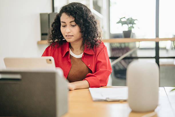 istock Businesswoman working at desk using laptop and typing document using modern technology in office. 2217902521