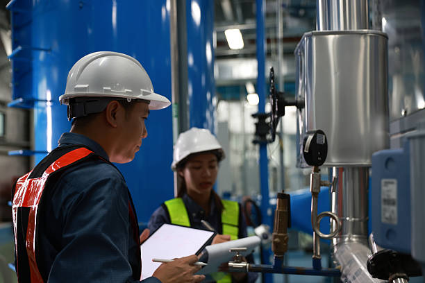 istock The chief instrumentation engineer and a junior engineer are inspecting the piping system and instrumentation of the new factory 2217910439