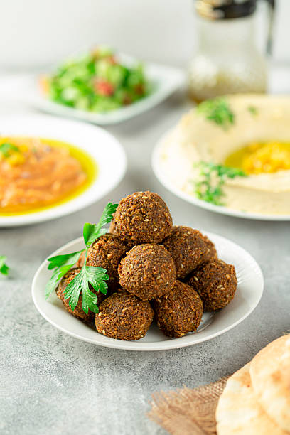 istock Falafel served on a light background, traditional Arabic breakfast with fried chickpea patties 2217911805