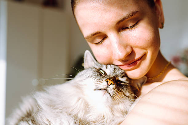 istock Portrait young woman with pet cat 2217911978