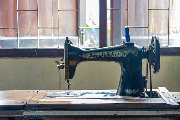 istock An old foot-drive sewing machine against the light from the windows 2217912578