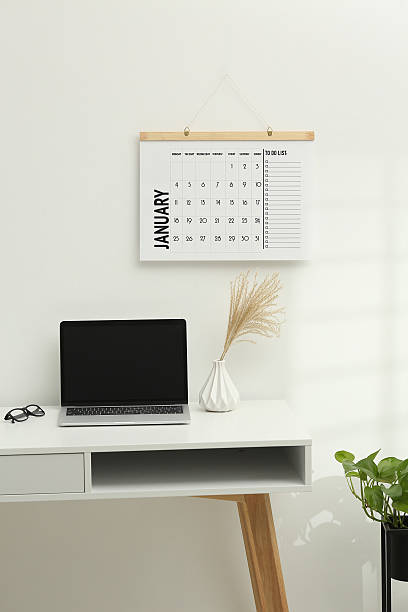 Desktop calendar on a modern desktop. Schedule and time planning in office and business.
