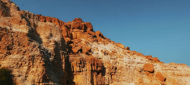 istock Rocky Sandstone Mountain With Sharp Cliffs And Erosion Details Low Angle Warm Toned Landscape 2217918970