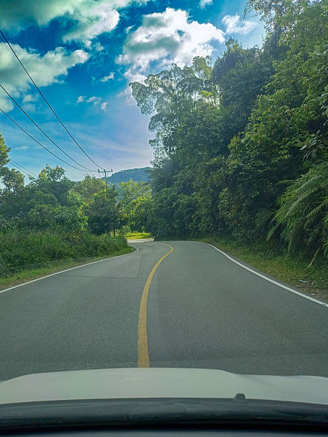 istock Winding Road Through Tropical Forest in West Sumatra, Indonesia 2217921620