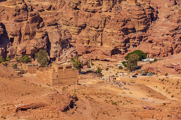 Petra, Jordan - November 3, 2022: Basin restaurant aerial view, tourists and camels at archaeological site