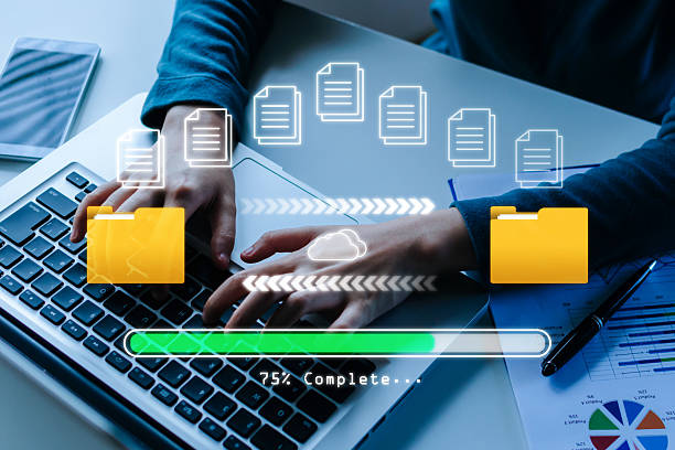 istock Backup File. business woman hand working on mobile laptop computer, file transfer, data center, cloud computing, backup storage management, artificial intelligence, cloud storage technology concept 2217928310