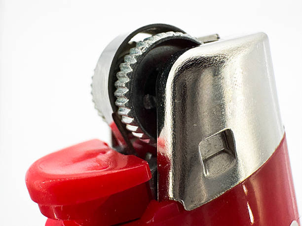 istock Red plastic lighter on a white background side view of the lighter in macro side view 2217944189