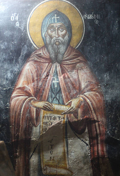 The Church of St. Nicholas in Kotor features a striking gold-leaf mosaic of Saint Nicholas above its main entrance. This vibrant artwork, set against a golden background, showcases the patron saint of sailors in traditional Orthodox iconography. It is prominently displayed on the pediment of the church's façade, just below the Serbian flag, and serves as a symbolic and artistic focal point for visitors approaching the church