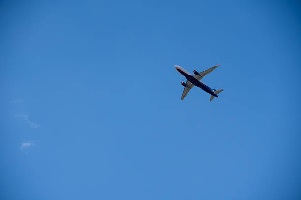 istock Passenger Plane Taking Off Against Blue Sky and Clouds 2217948455