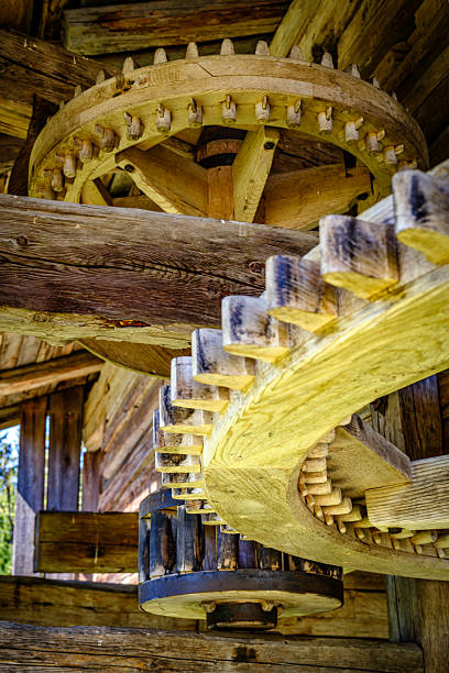 istock Detailed view of interlocking gears working together in a mechanical system during daylight 2217950410