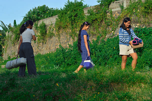 istock Girls change direction while carrying camping gear 2217951318